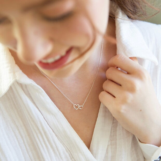 Tiny Interlocking Hearts Necklace in Silver